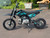 Main: 2026 IBX Roost PAD125-1F 125cc Teal fully automatic pit bike
Side View: Teal IBX Roost 125cc full automatic pit bike side view
Front Wheel: IBX Roost 14 inch front off-road wheel
Rear Wheel: IBX Roost 12 inch rear off-road wheel