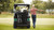 Gray Tara Spirit Pro Classic electric golf cart with luxury seating, foldable windshield, turf-friendly tires, and professional golf course design.