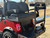 TEKO EV Turbo 4 passenger lithium electric golf cart with touchscreen display, LED underglow lighting and rear flip seat at East Central Sports Rush City Minnesota