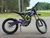 Side View: Purple 2025 Surron Light Bee X electric dirt bike side view