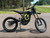 Side View: Black 2025 Surron Light Bee X electric dirt bike side view