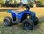 The image features the Denago E-Hawk 6 ATV, a sleek and modern electric ATV designed for kids aged 6 and up. The ATV showcases a bold black finish with multicolored LED lights, giving it a stylish and futuristic look. The rugged all-terrain tires (AT 16 x 8-7) and double A-arm front suspension highlight its capability to handle various terrains, from dirt trails to grassy fields. The handlebar-mounted controls, including the push-button gear selector and keyed ignition, are clearly visible, emphasizing the ATV's user-friendly design. The compact dimensions (51" x 31" x 32.5") and low seat height (23.5") make it perfectly sized for young riders, while the 48V removable lithium-ion battery and 1600W brushless electric motor underscore its eco-friendly and high-performance features. Safety elements like dual hydraulic disk brakes and an anti-theft alarm are subtly integrated into the design. This image captures the essence of the E-Hawk 6 ATV as a safe, fun, and technologically advanced electric vehicle for kids.