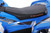 The image features the Denago E-Hawk 6 ATV, a sleek and modern electric ATV designed for kids aged 6 and up. The ATV showcases a bold black finish with multicolored LED lights, giving it a stylish and futuristic look. The rugged all-terrain tires (AT 16 x 8-7) and double A-arm front suspension highlight its capability to handle various terrains, from dirt trails to grassy fields. The handlebar-mounted controls, including the push-button gear selector and keyed ignition, are clearly visible, emphasizing the ATV's user-friendly design. The compact dimensions (51" x 31" x 32.5") and low seat height (23.5") make it perfectly sized for young riders, while the 48V removable lithium-ion battery and 1600W brushless electric motor underscore its eco-friendly and high-performance features. Safety elements like dual hydraulic disk brakes and an anti-theft alarm are subtly integrated into the design. This image captures the essence of the E-Hawk 6 ATV as a safe, fun, and technologically advanced electric vehicle for kids.