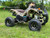 The image showcases the Tao Motor D125 Youth ATV in a dynamic, off-road setting, highlighting its sleek design and vibrant color options. The ATV features a powder-coated frame, color-matched components, and new decal designs, giving it a modern and stylish appearance. The LED daytime running lights are prominently displayed, emphasizing safety and visibility. The adjustable front and rear shocks and 16-inch tires are visible, showcasing the ATV's capability to handle rough terrains. The ergonomic gear selector and digital gear indicator are also highlighted, emphasizing user-friendly controls. This image perfectly captures the D125's blend of performance, safety, and style, making it an ideal choice for young riders. The image showcases the Tao Motor D125 Youth ATV in a dynamic, off-road setting, highlighting its sleek design and vibrant color options. The ATV features a powder-coated frame, color-matched components, and new decal designs, giving it a modern and stylish appearance. The LED daytime running lights are prominently displayed, emphasizing safety and visibility. The adjustable front and rear shocks and 16-inch tires are visible, showcasing the ATV's capability to handle rough terrains. The ergonomic gear selector and digital gear indicator are also highlighted, emphasizing user-friendly controls. This image perfectly captures the D125's blend of performance, safety, and style, making it an ideal choice for young riders.