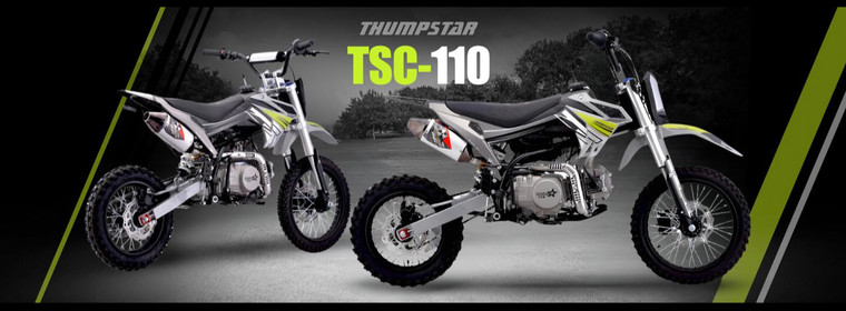 Thumpstar TSC 110 Pit Bike in action, highlighting its sleek stealth black plastics, gripper stripe seat, and robust wrap-around frame. The bike is shown navigating rough terrains, emphasizing its durability and off-road capabilities. Key features such as the forged triple clamps, waterproof wiring, and stator guard are visible, showcasing the bike's premium build quality. The image also highlights the 110cc engine, 26mm carburetor, and high-performance suspension system, making it clear that the TSC 110 is designed for both reliability and performance.