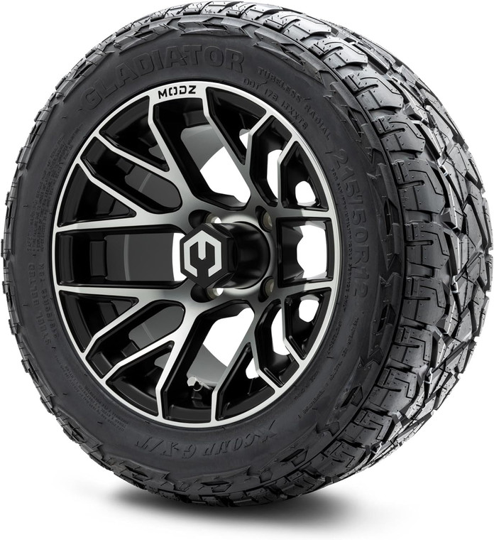The image showcases a set of four MODZ® Matrix Machined Black 12" Golf Cart Wheels paired with X-Comp Gladiator (215/50-R12) DOT Steel-Belted Radial Tires. The wheels feature a striking machined black finish with a modern, rugged design, complemented by chrome lug nuts and center caps. The tires are robust and treaded, designed for both street and turf use. The combo is professionally mounted and balanced, ready to enhance the performance and appearance of any lifted golf cart.