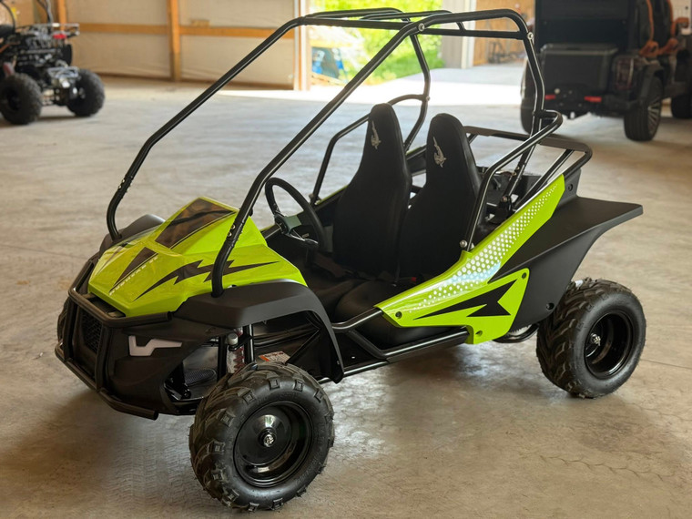 The image showcases the Hammerhead by Polaris MudHead SE, a sleek and stylish go-kart designed for young adventurers aged 10 and up. The go-kart features a modern design with upgraded plastic body panels and a steel bumper, emphasizing its durability and style. The 208cc LCT electric-start engine is highlighted, showcasing the go-kart's power and ease of use. The dual LED headlights and canopy top are visible, adding to the go-kart's functional and stylish design. The ROPS roll cage and three-point safety belts are prominently displayed, underscoring the go-kart's commitment to safety. The 16-inch tires and rear hydraulic disc brake ensure excellent traction and reliable stopping power. Overall, the image captures the essence of a safe, durable, and fun go-kart ready for endless adventures.