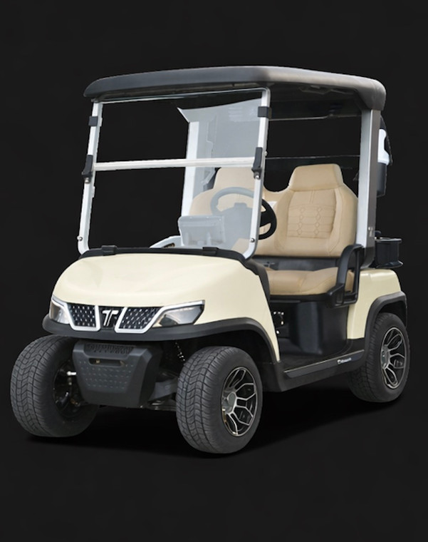 Beige Tara Spirit Pro electric golf cart with luxury seating, foldable windshield, turf-friendly tires, and refined golf course styling.