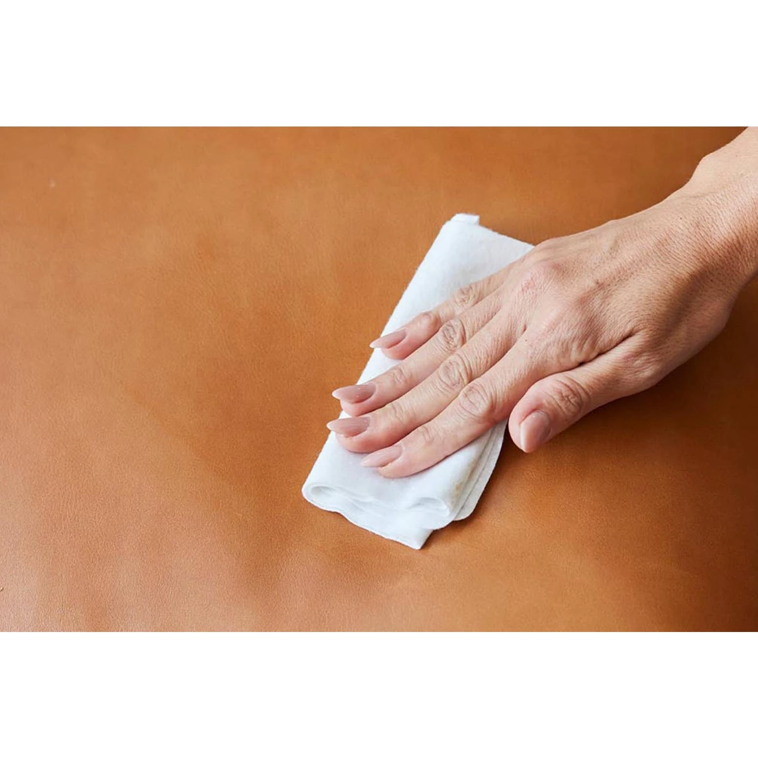 a person holding a white towel