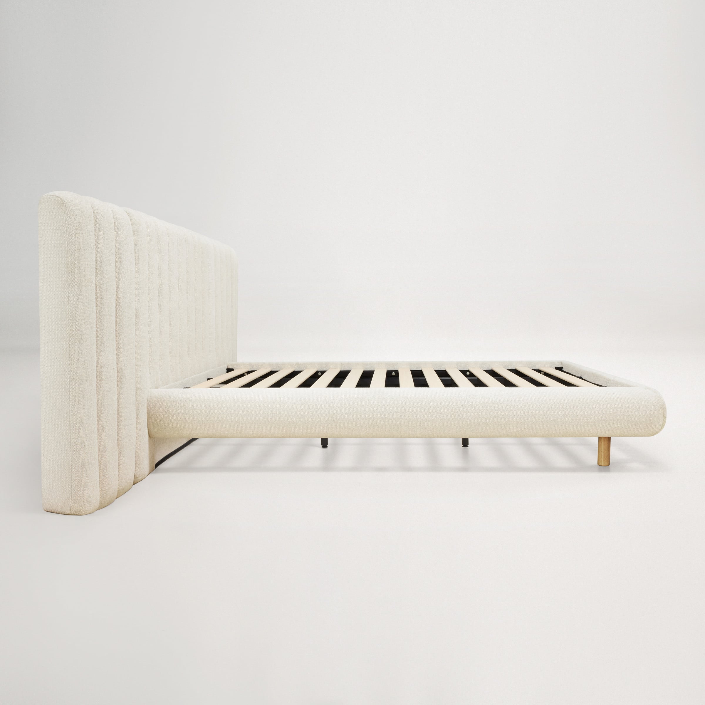 a white piano with a white chair