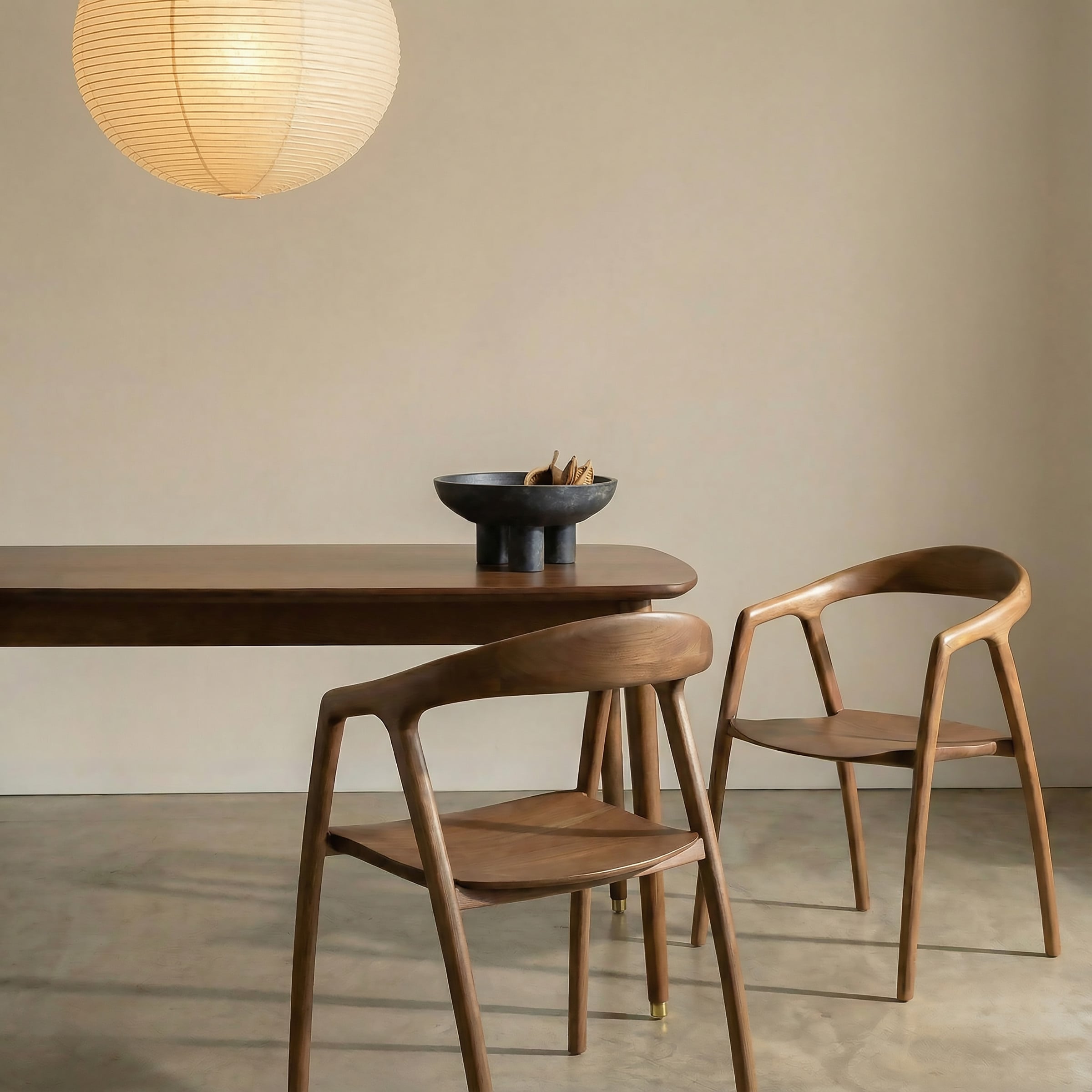 a table with chairs and a bowl on it