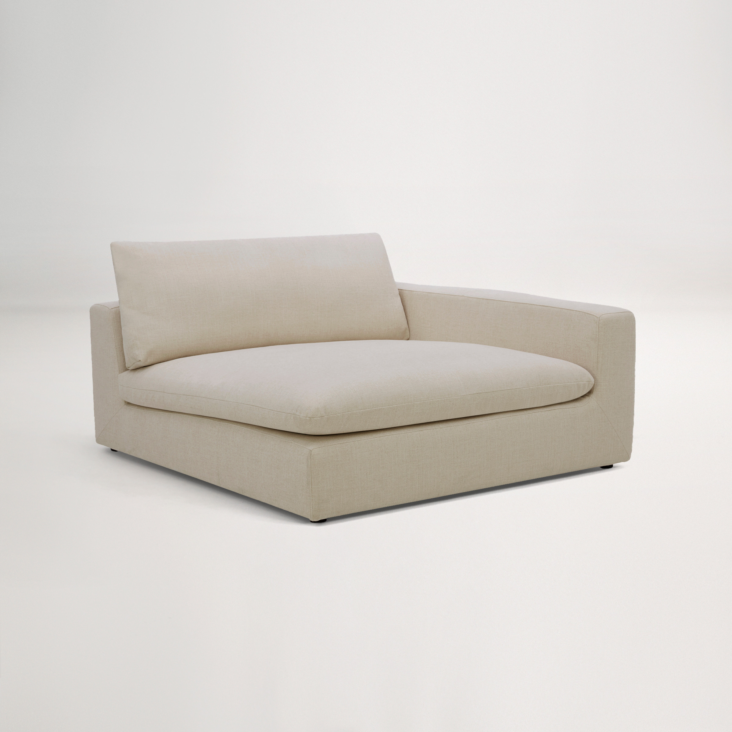 a white couch with a cushion