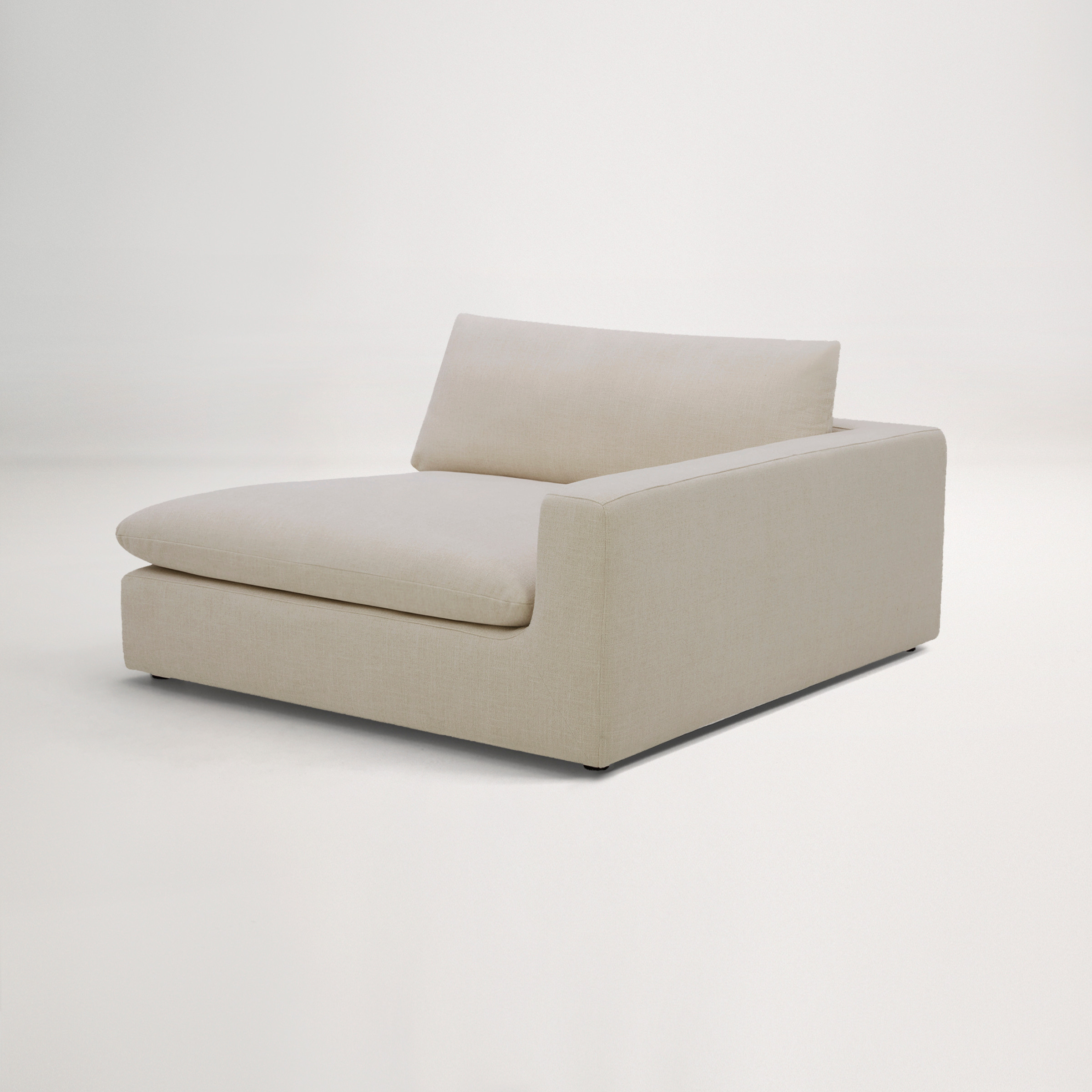 a white couch with a cushion