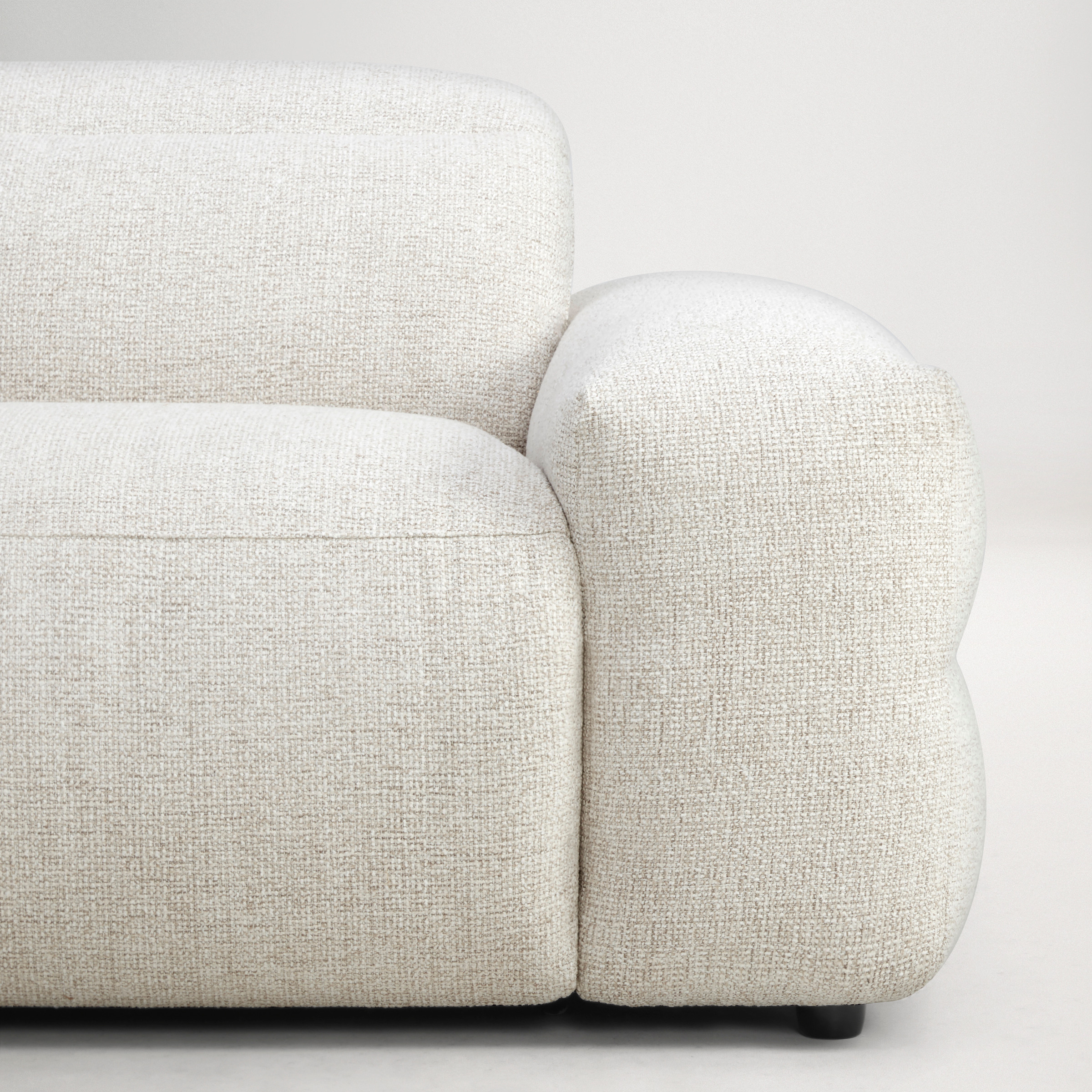 a white couch with a cushion
