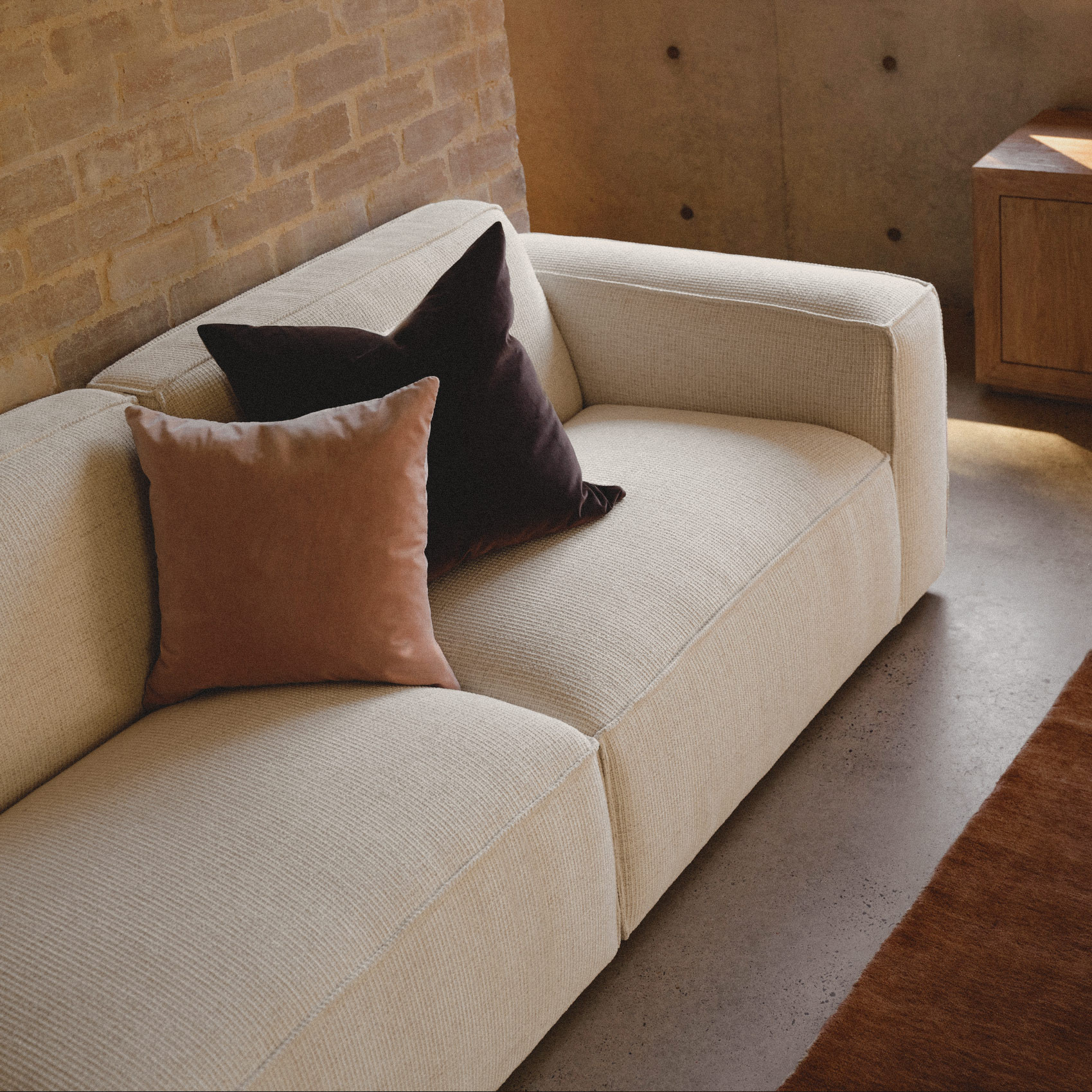 a white couch with pillows