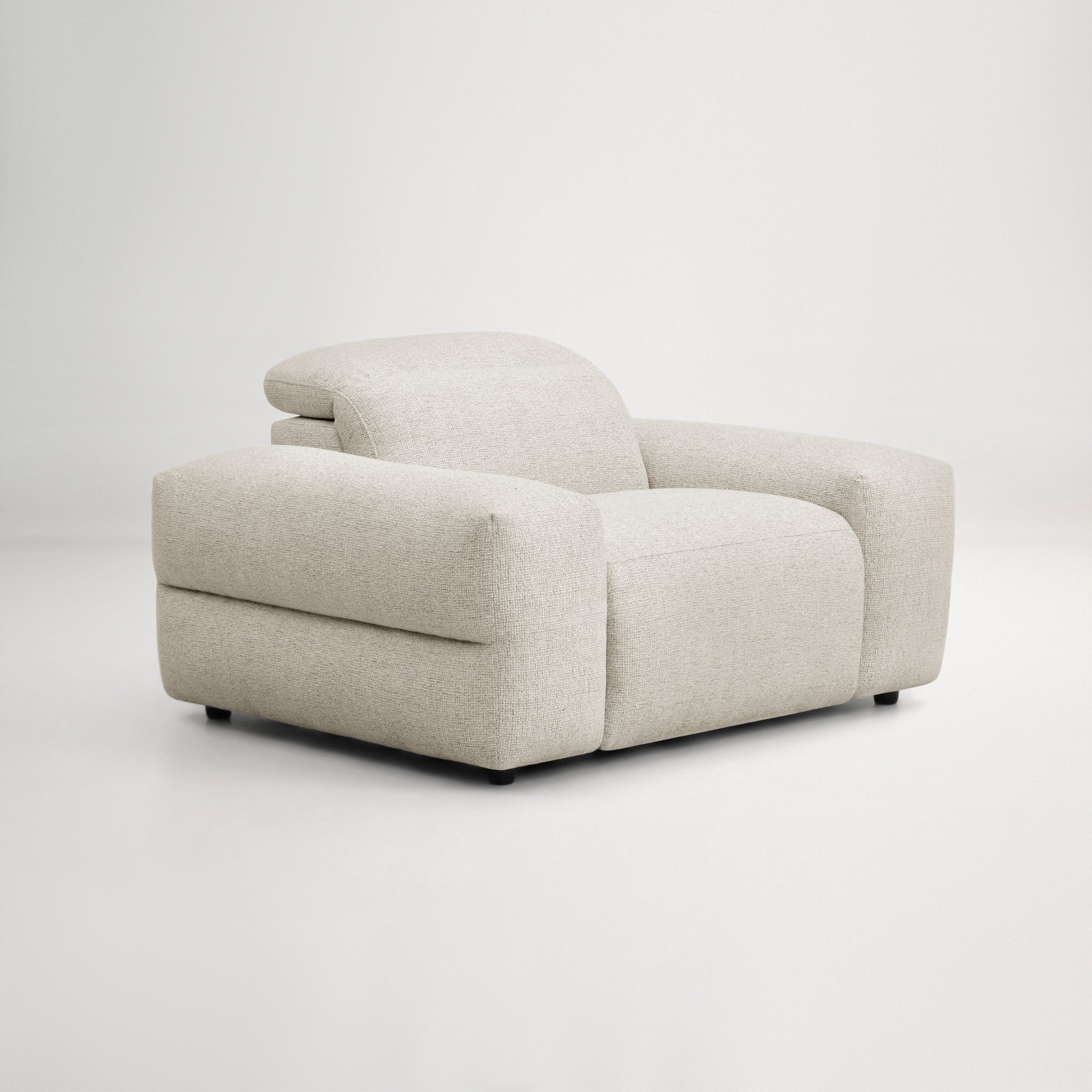 a white couch with a cushion