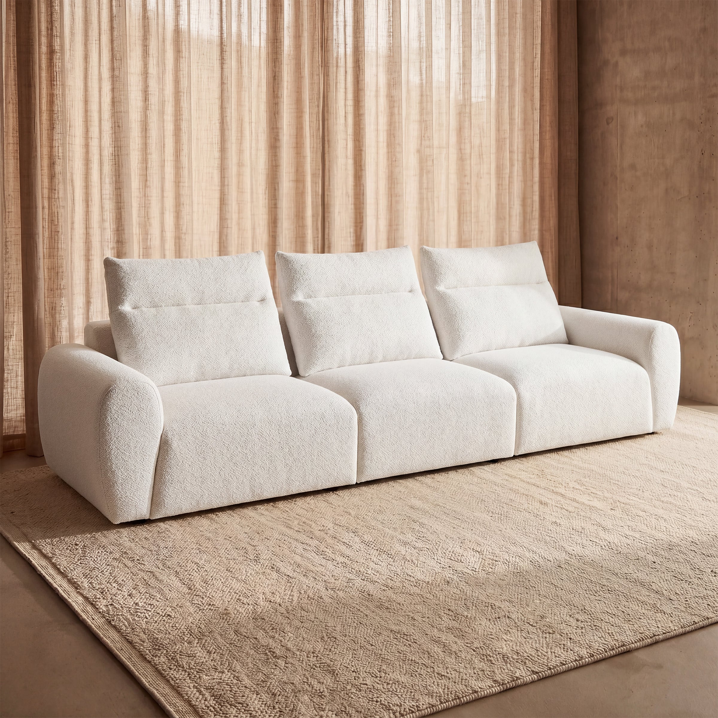 a white couch with a brown wall