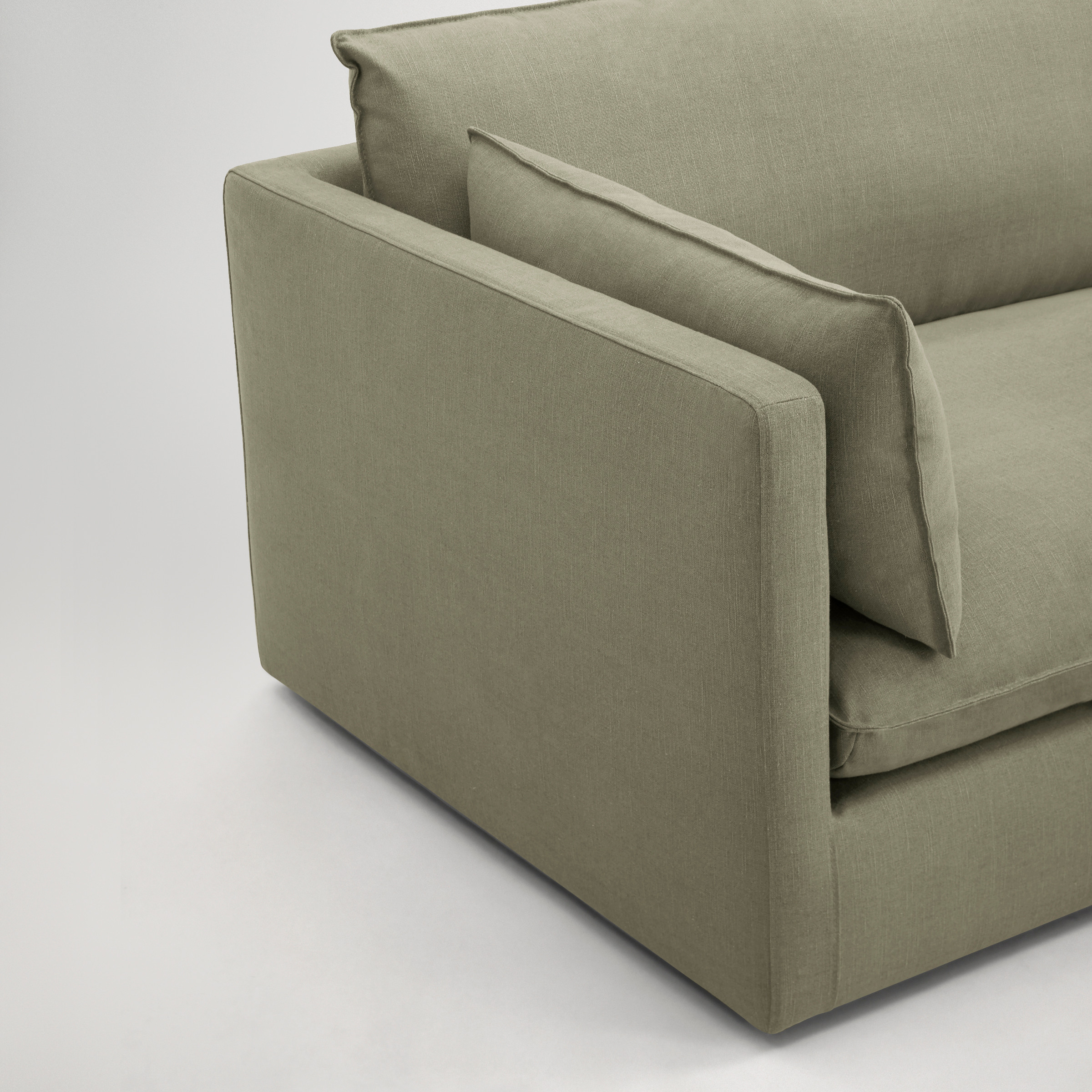 a grey couch with a white background
