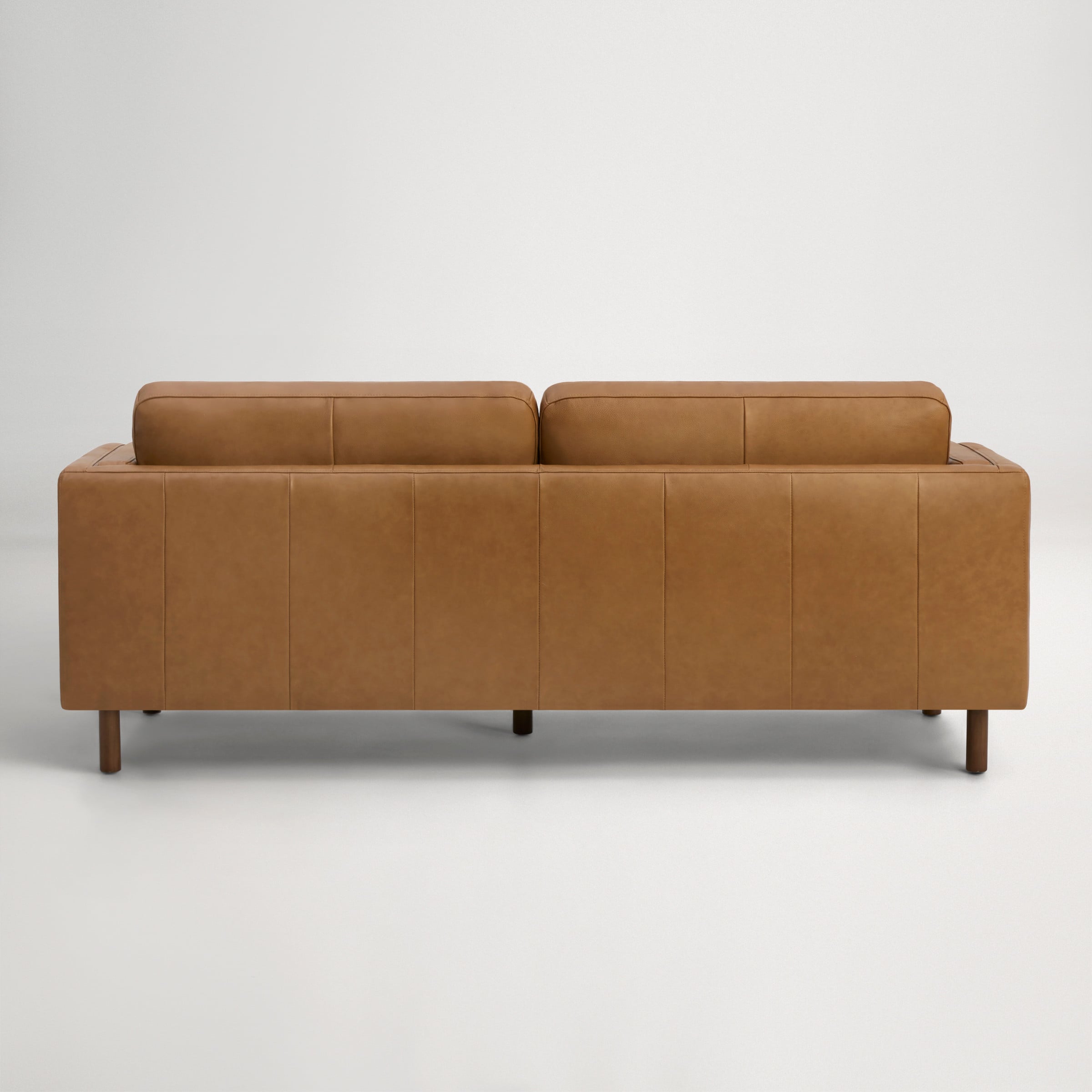 a brown couch with a black arm rest