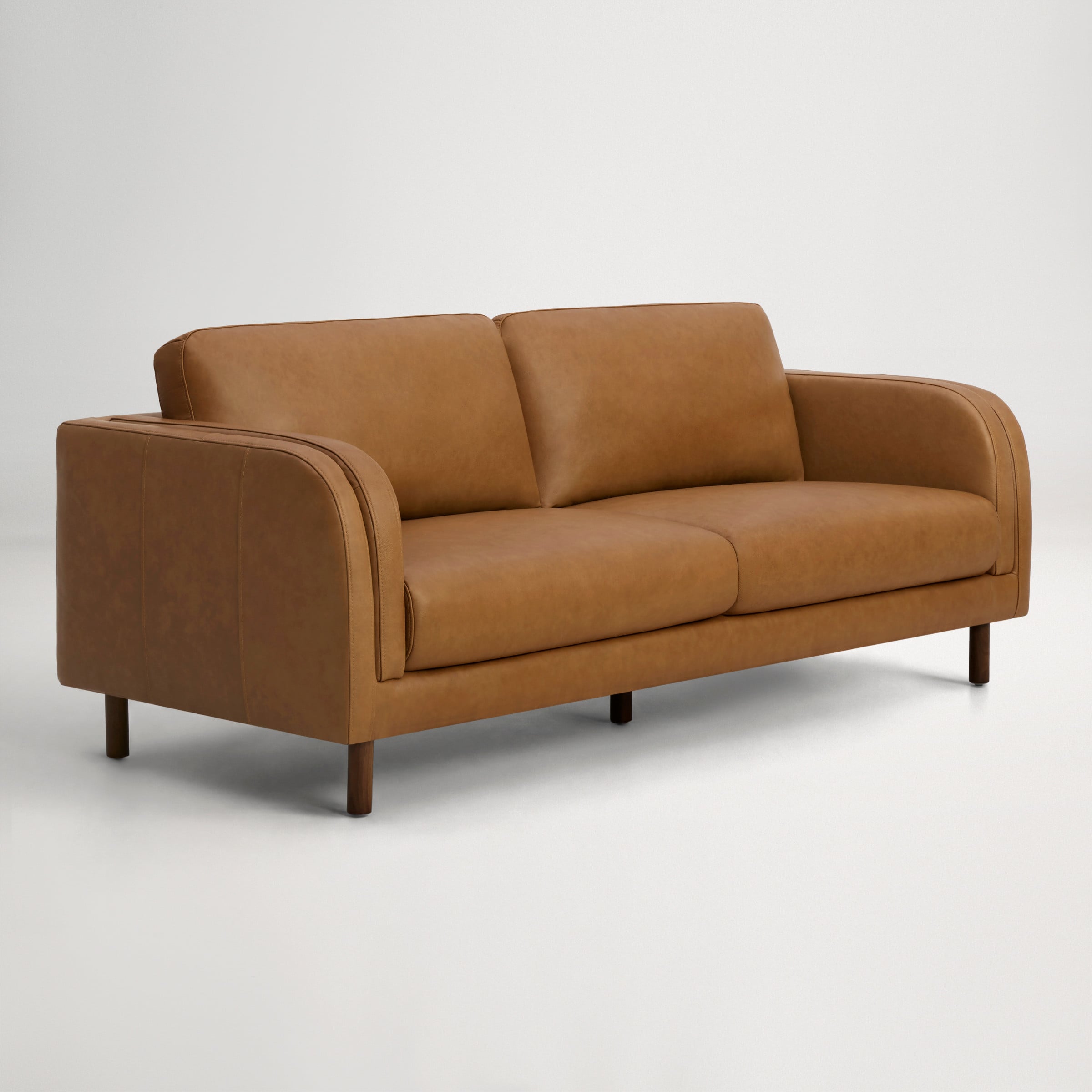 a brown couch with a cushion