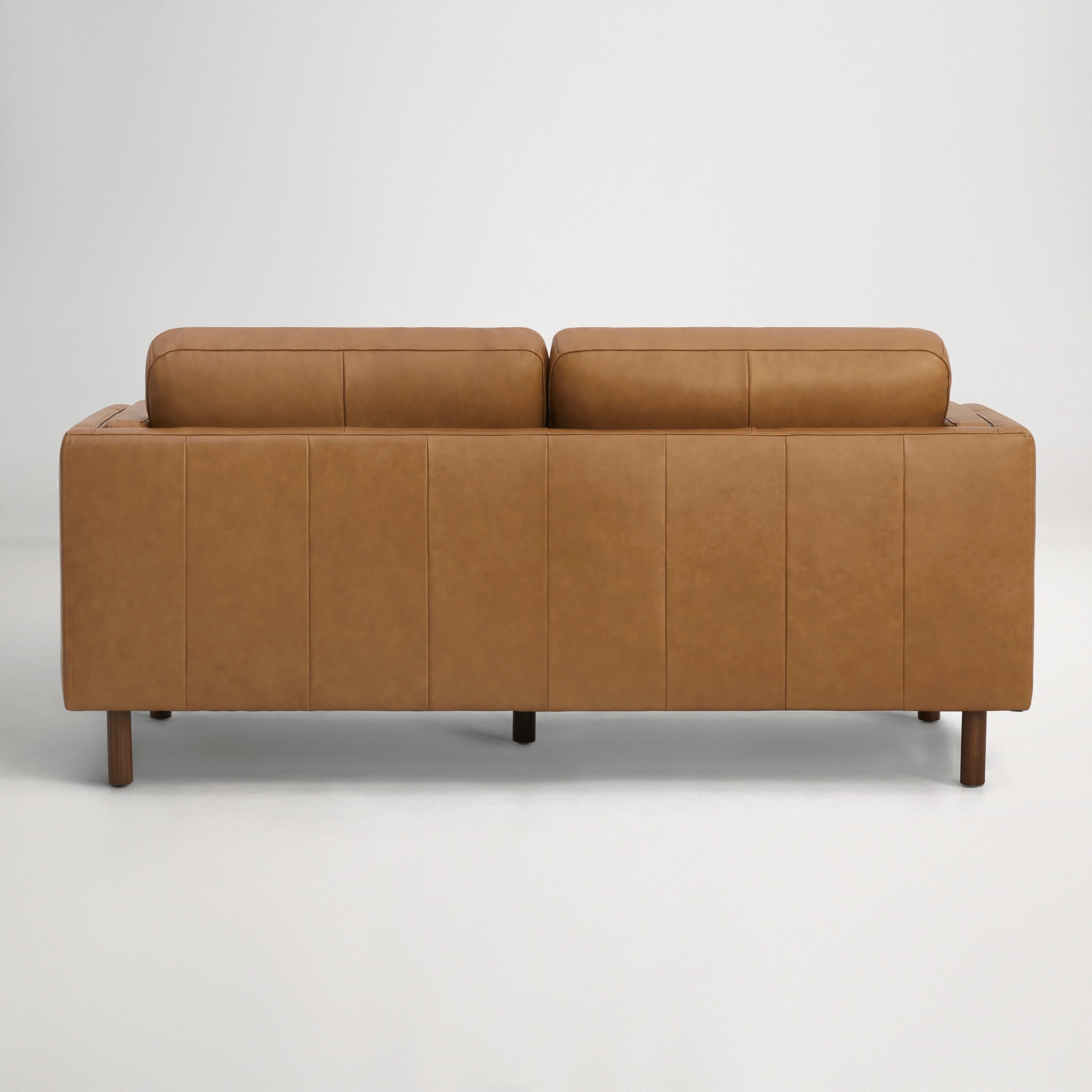 a brown couch with a black arm rest