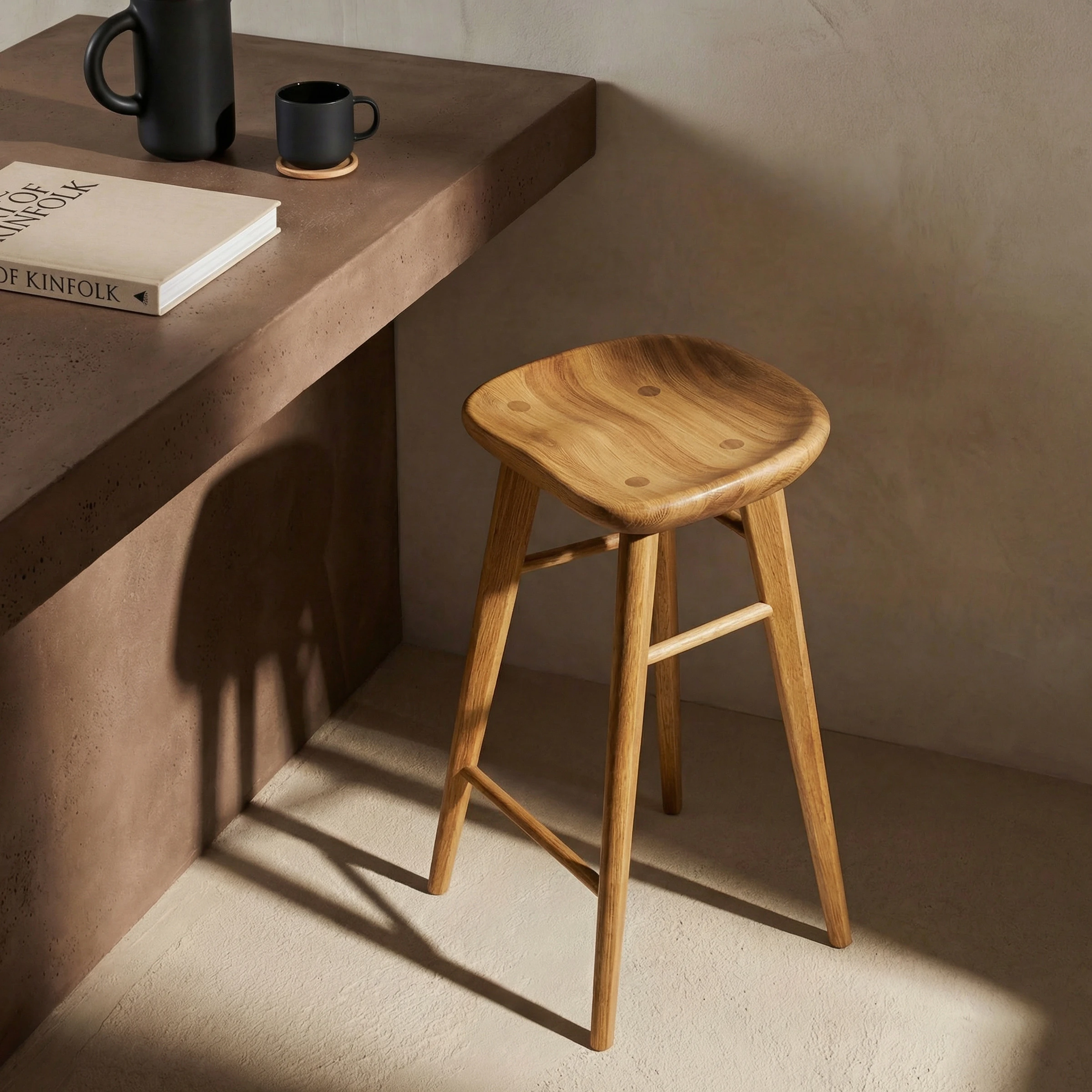 a wooden desk with a book and a cup on it