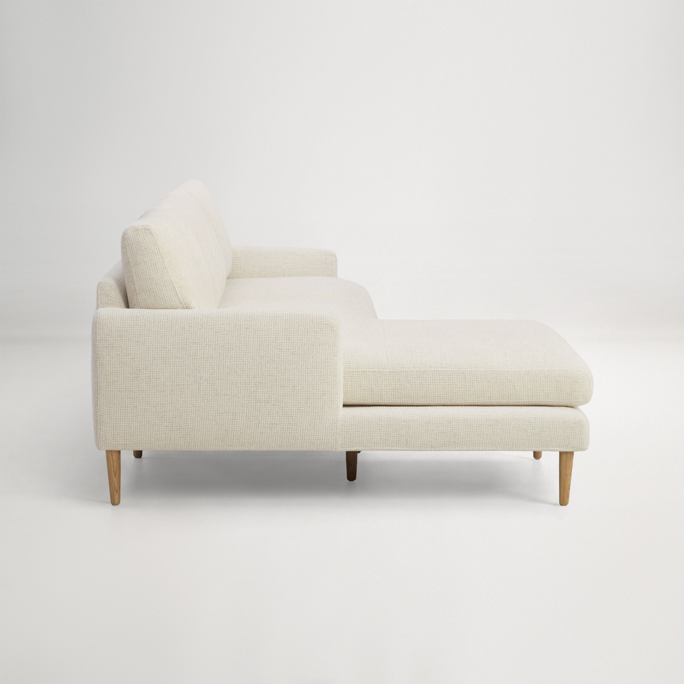 a white couch with a white back