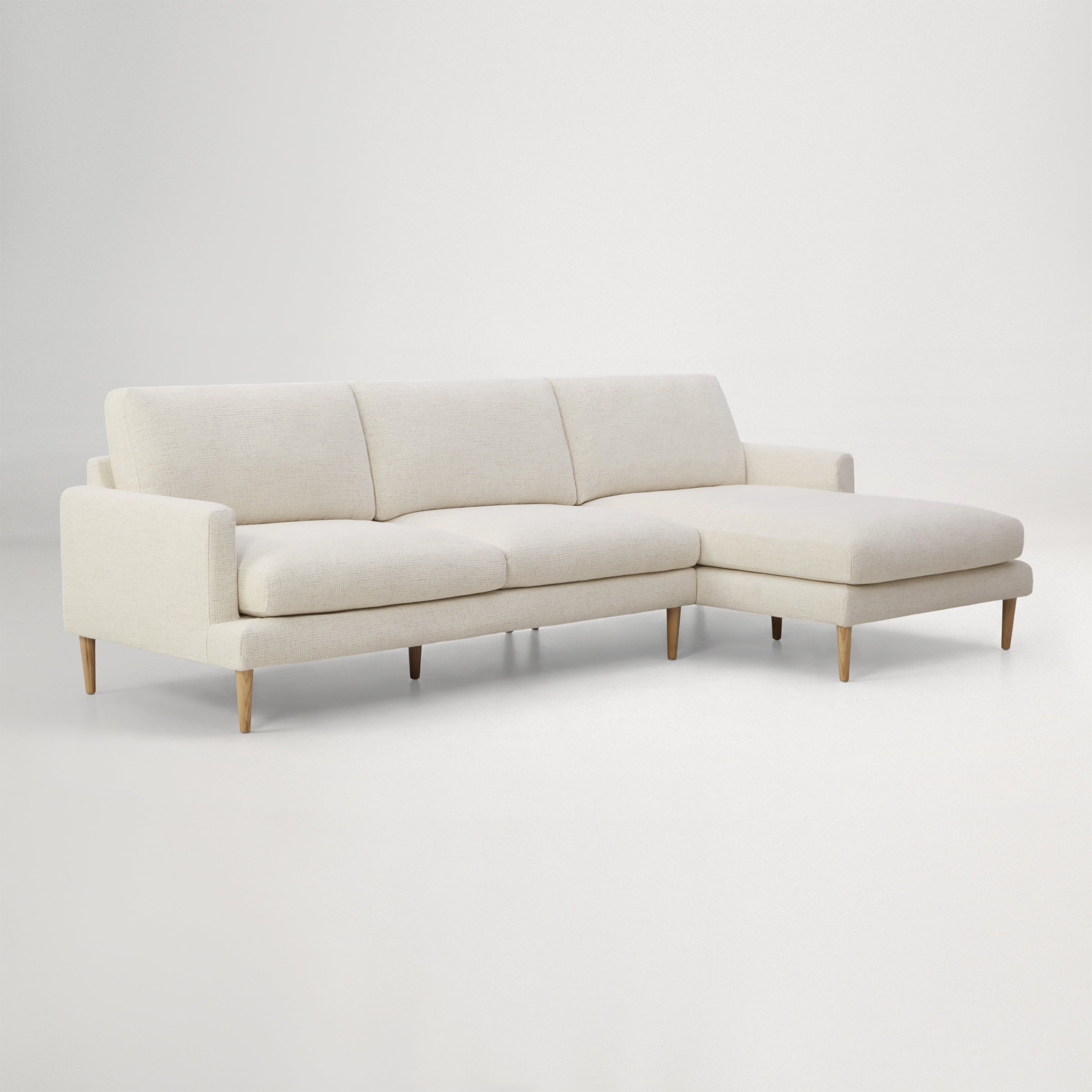 a white couch with a white back