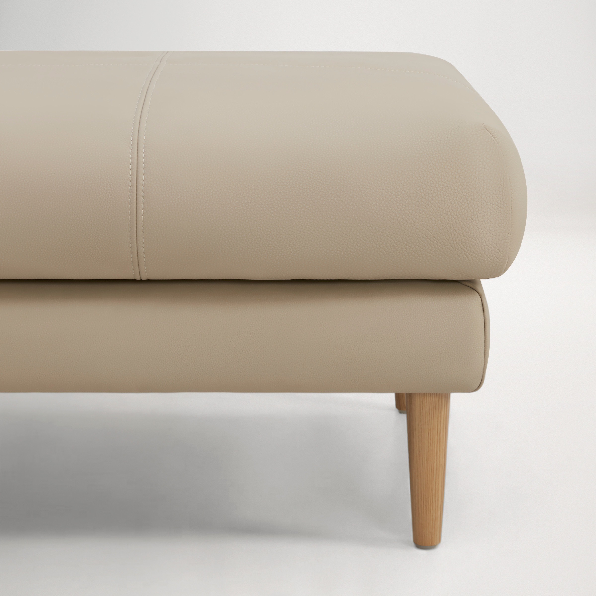 a white chair with a grey cushion