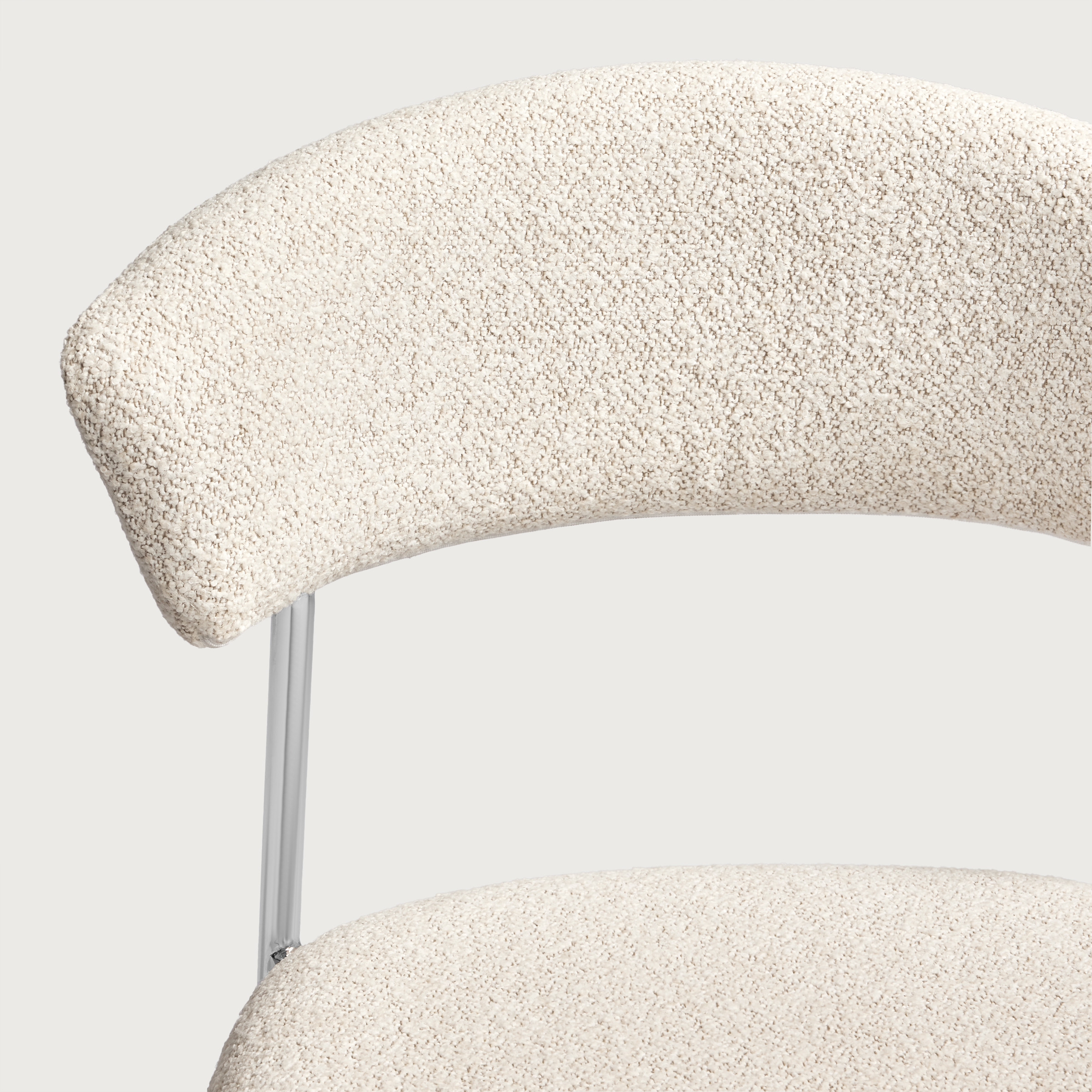 a white chair with a white cushion