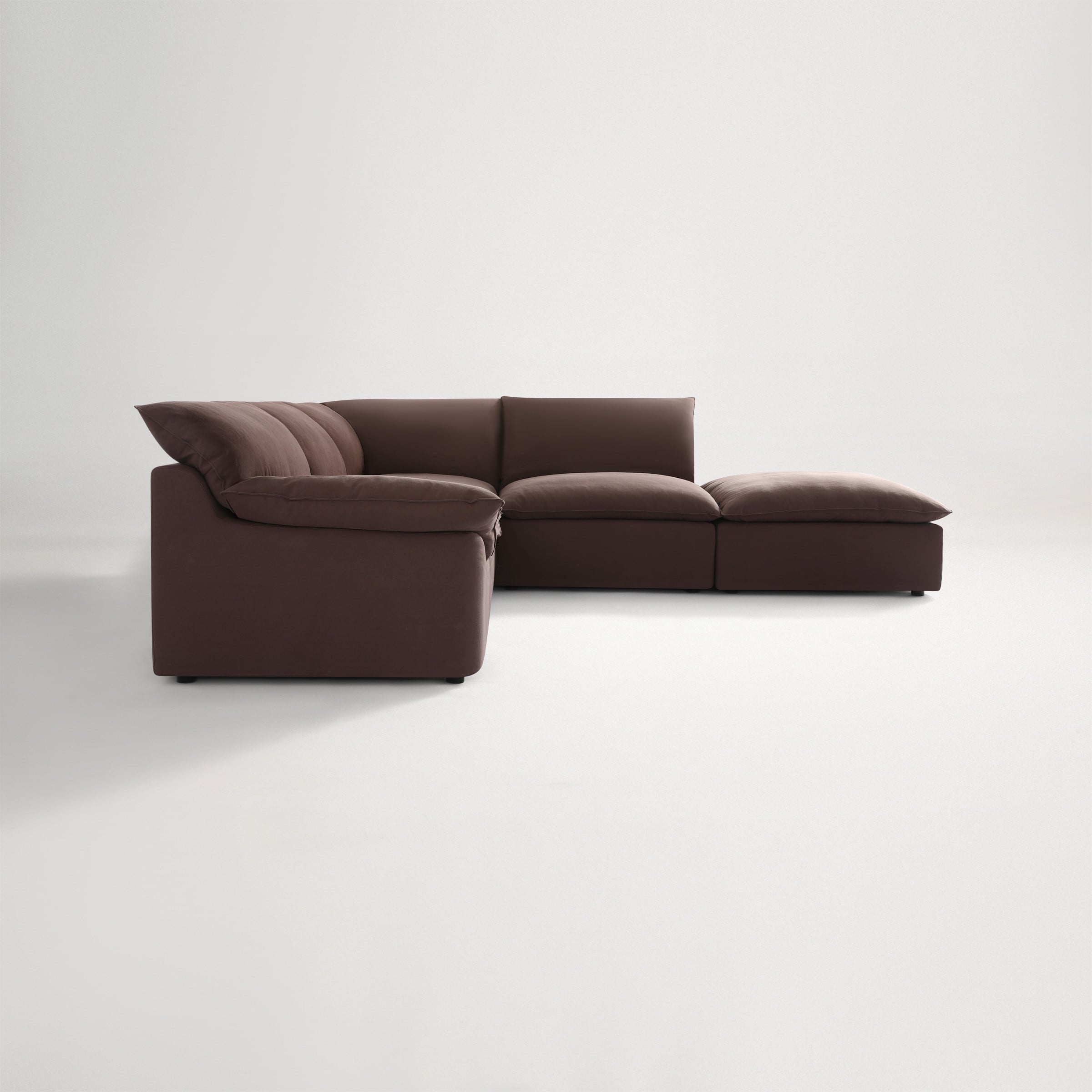 a brown couch with a grey cushion