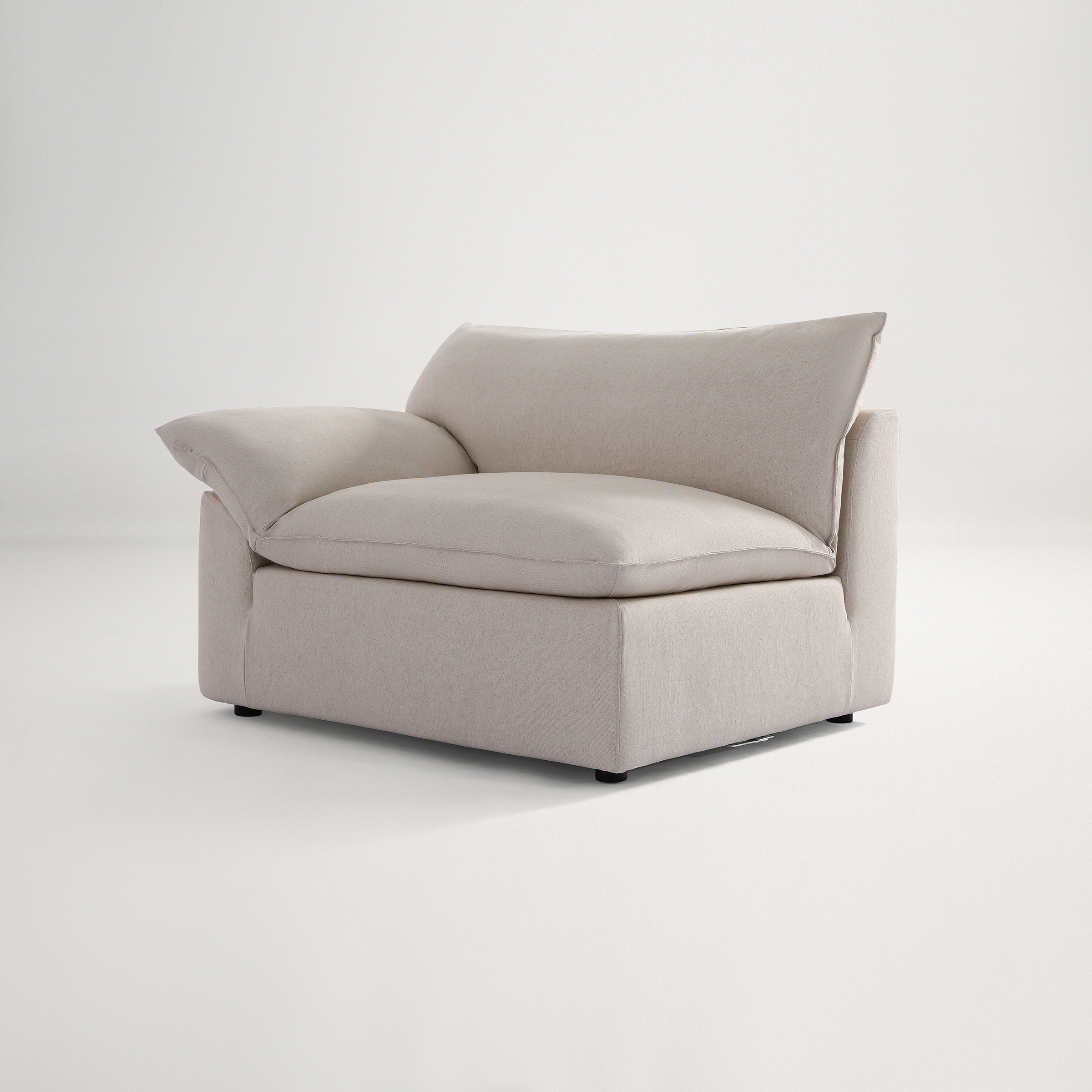 a white couch with a cushion