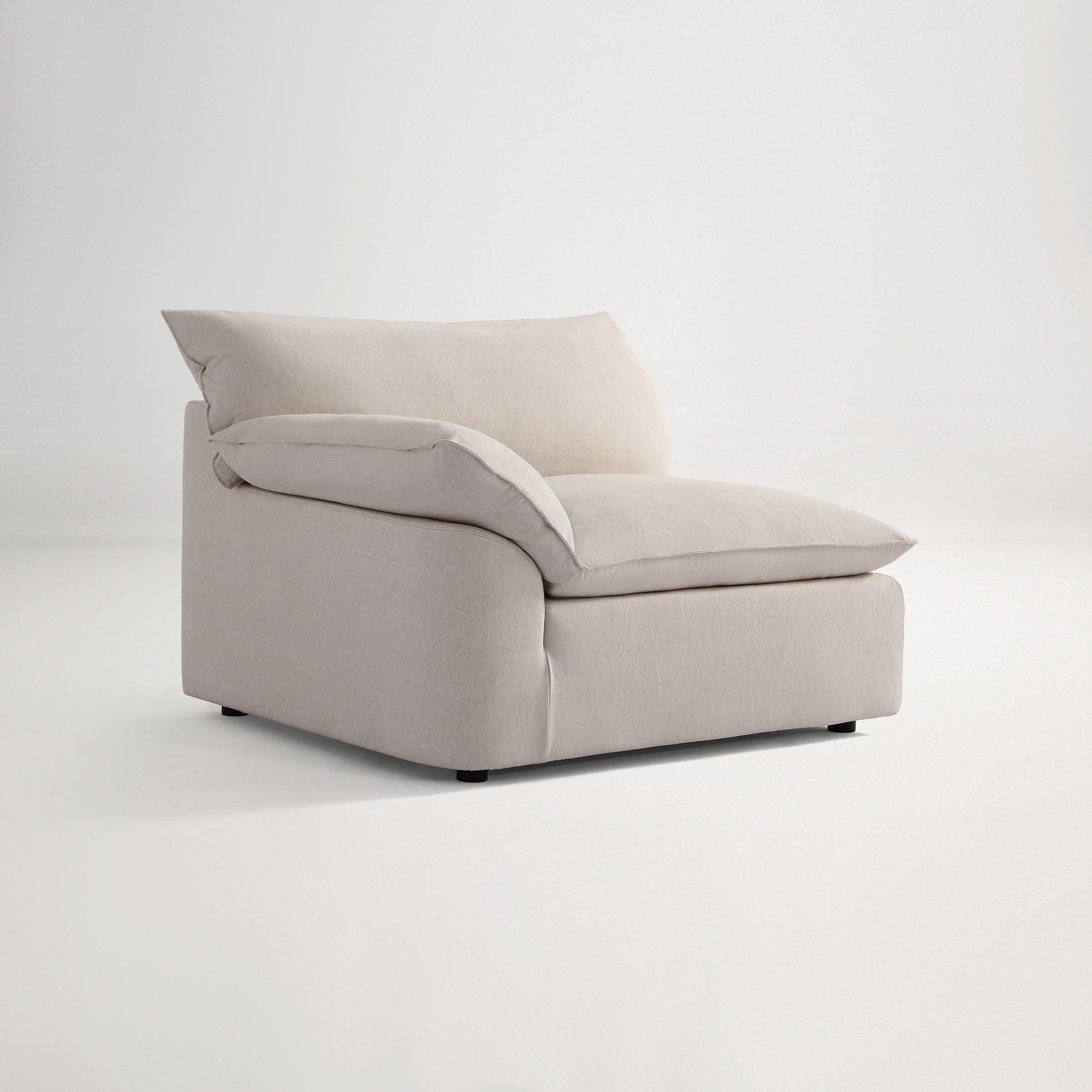 a white couch with a cushion