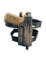 DARA LEVEL 2 RETENTION PACKAGE, tan gun in black holster and belt, race rig for competition shooting.