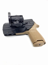 DARA mounted vehicle holster with tan kydex grip and black ram mount base for Glock, Sig, HK.