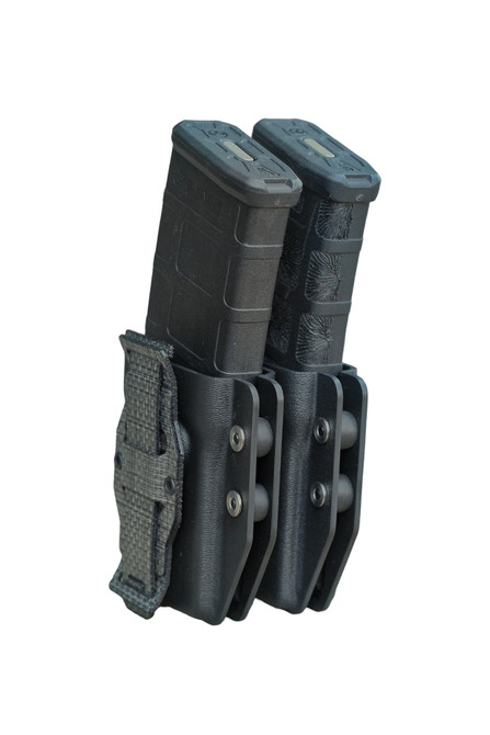 Kydex AR Mag Carrier holding two black rifle magazines with adjustable retention system and MOLLE attachment.