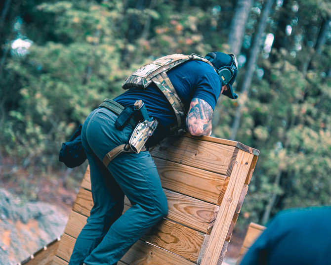 Dara Level 2 Duty Holster on a law enforcement officer's firearm during tactical training exercise outdoors.