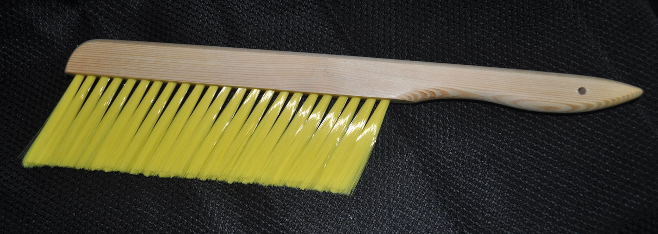 The soft yellow bristles of our bee brush are easier on your bees. 