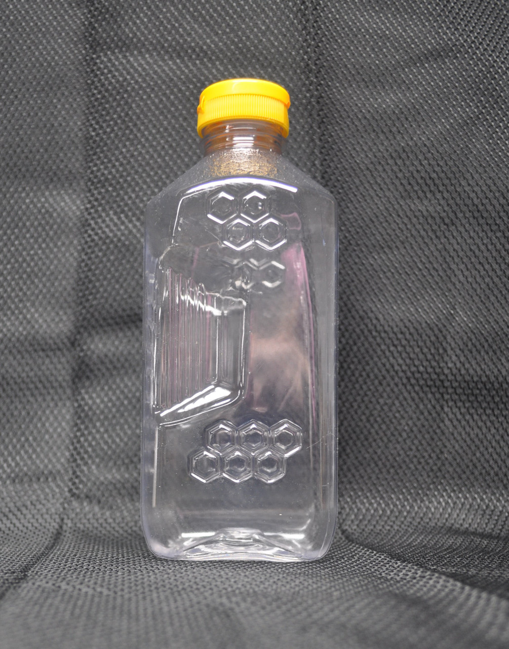 3 lb. honeycomb pattern honey bottle with flip-top cap side detail