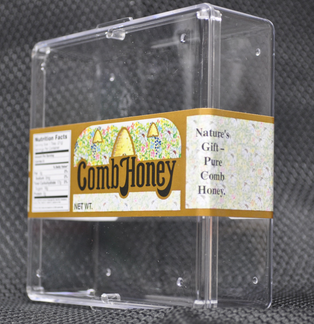 Comb honey label on plastic comb honey tray. side view.