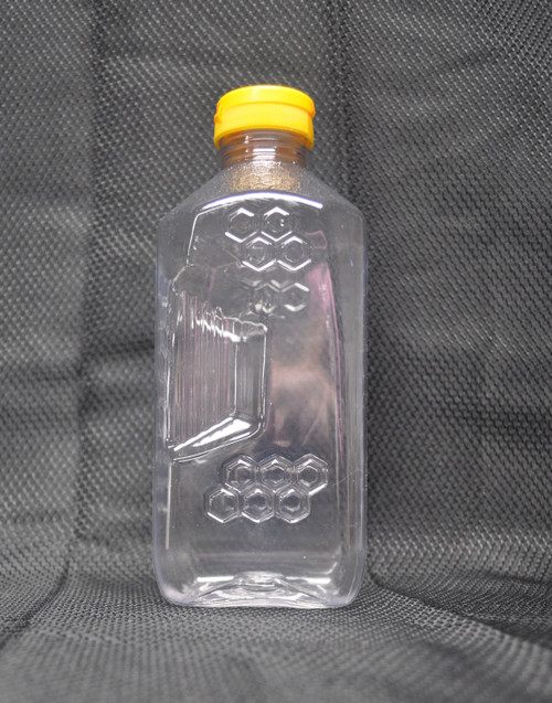 3 lb. honeycomb pattern honey bottle with flip-top cap, side detail