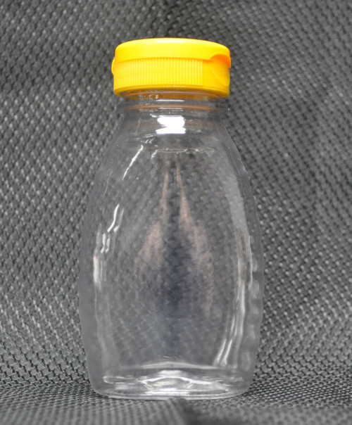 8 oz. clear plastic honey bottle with flip-top lid
