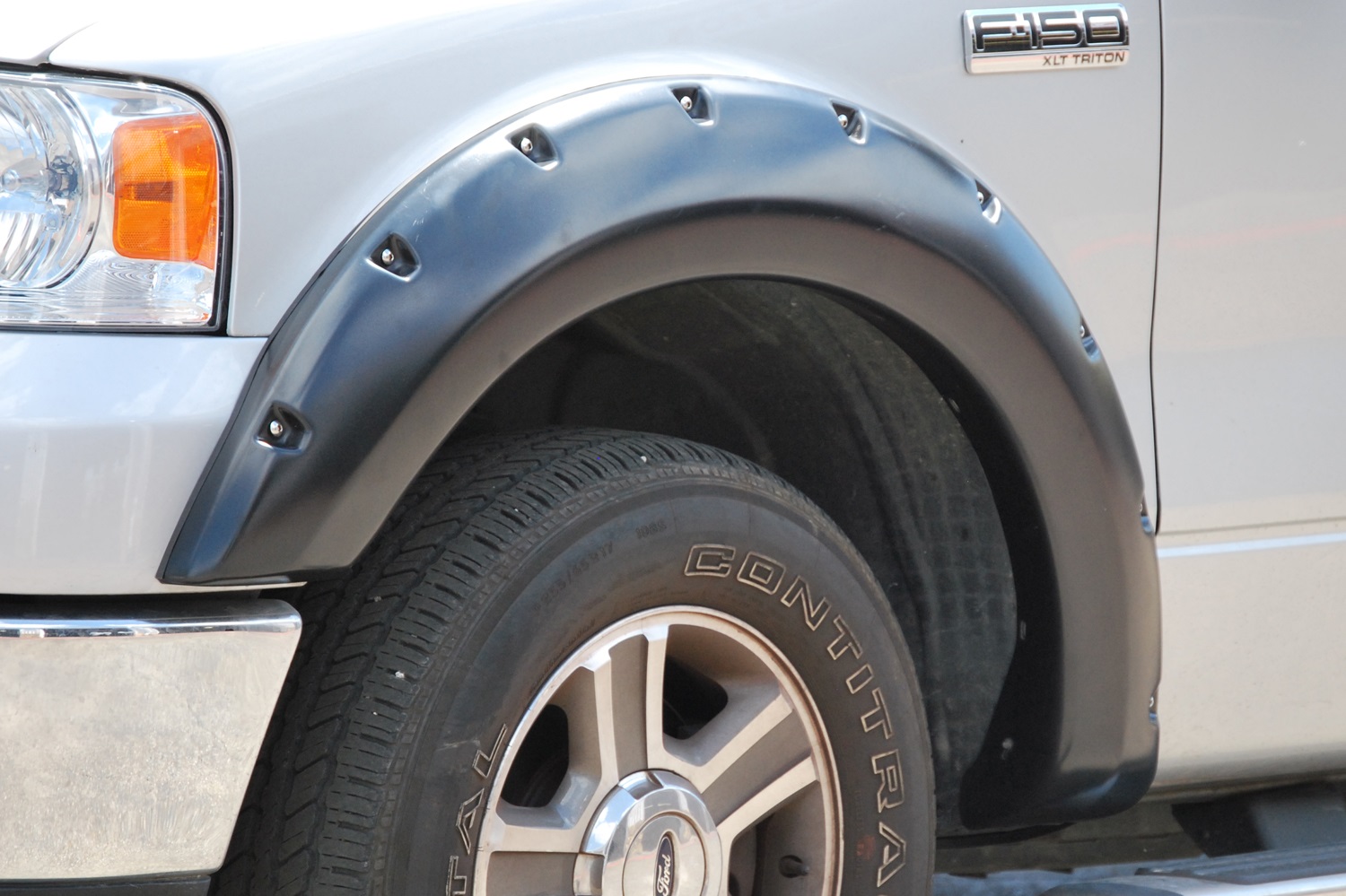 Lund RX310SA Elite Series Black Rivet Style Smooth Finish Front Fender Flares for 2004-2008 Ford F-150 (Excludes Stepside)-RX310SA