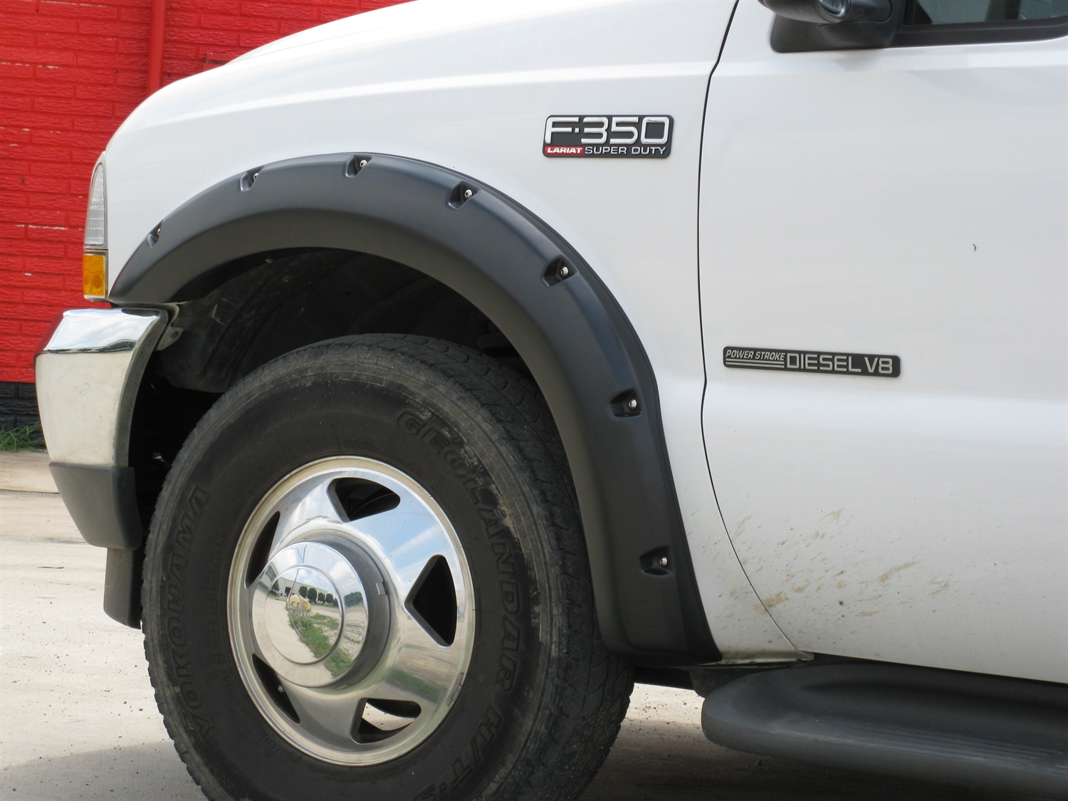 Lund RX311T Elite Series Black Rivet Style Textured Finish 4-Piece Fender Flare Set for 1999-2007 Ford F-250, F-350 (Excludes Dually)-RX311T