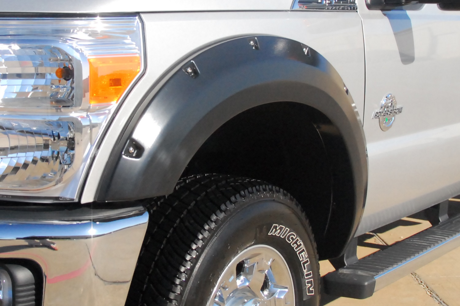 Lund RX314S Elite Series Black Rivet Style Smooth Finish 4-Piece Fender Flare Set for 2011-2016 Ford F-250, F-350 (Excludes Dually)-RX314S
