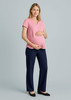 A maternity pant in navy blue, paired with a pink top, worn by a pregnant model. Features a logo.