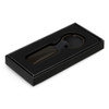 A rectangular black key ring presented in a black box with an insert. The key ring includes a logo.