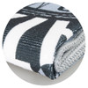 A grey and white sports towel, folded with a textured surface and featuring a logo.
