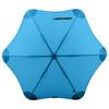 A blue BLUNT Classic Umbrella with an octagonal shape and a central hub, featuring a logo.