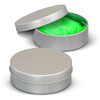 A silver tin container with a bright green stress putty inside, partially visible.